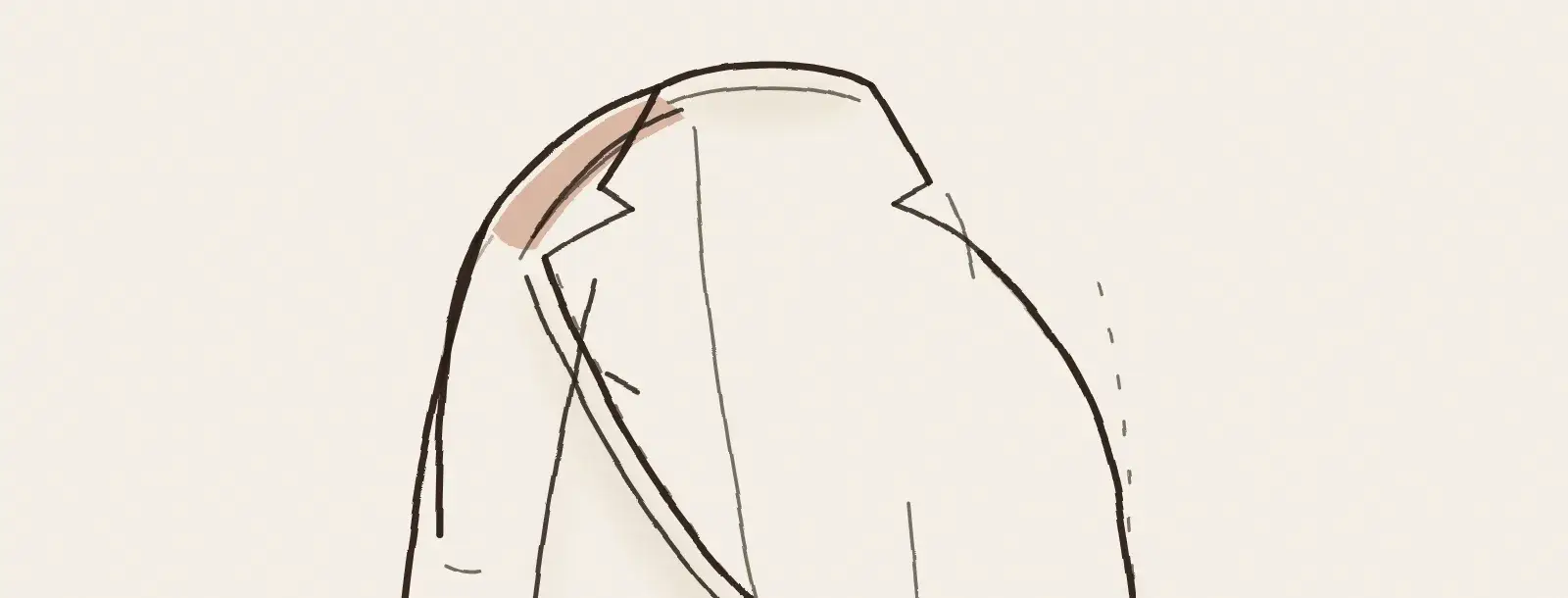 Veste de costume aux épaules repliées, prête pour la valise